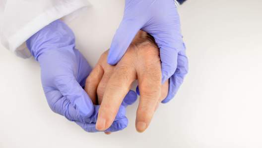 doctor-holding-patients-hand-01-GettyImages-825390478.jpg