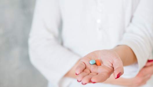 hand-with-two-pills-GettyImages-1077723758-3000x2000.jpg