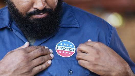 man-with-i-voted-sticker-GettyImages-2165464468-3000x2000-sm.jpg