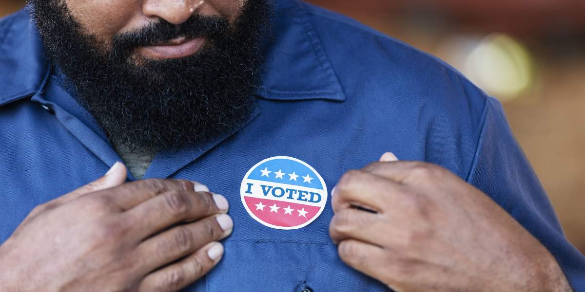 man-with-i-voted-sticker-GettyImages-2165464468-3000x2000.jpg