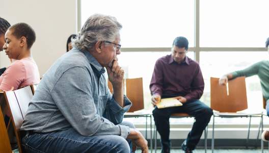 pensive-man-in-waiting-room-GettyImages-1688953969-3000x2000.jpg