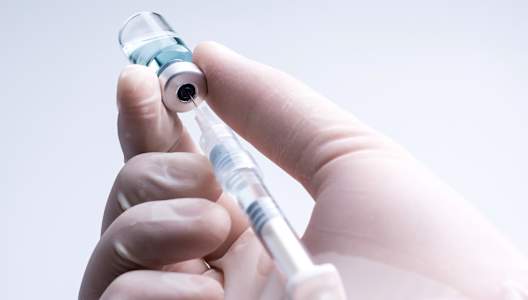 white-medical-glove-holding-syringe-GettyImages-1326222185-3000x2000.jpg