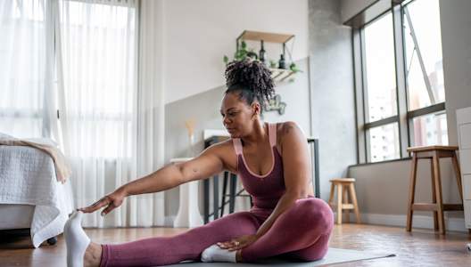 woman-yoga-stretching-GettyImages-1444292324-3000x2000-sm.jpg