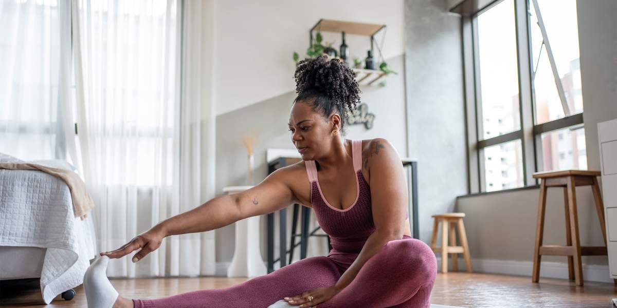 woman-yoga-stretching-GettyImages-1444292324-3000x2000.jpg